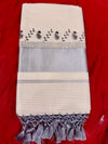 Kerala cotton saree with intricate black prints and silver border