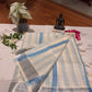 Kerala cotton saree with serene blue stripes and silver zari border