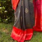 Black georgette saree with red border