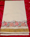 Kerala cotton saree in a classic off-white hue with floral embroidery