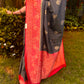 Black georgette saree with red border