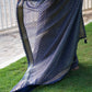 Georgette Tissue Saree in Navy Blue with Bandhini Work and Scalp Border