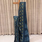 Pure Modal Silk Saree in a captivating teal blue shade with a striking vanaspathi (foliage) print in vibrant yellow and deep black