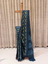 Pure Modal Silk Saree in a captivating teal blue shade with a striking vanaspathi (foliage) print in vibrant yellow and deep black